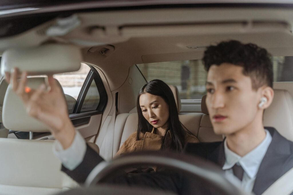 Chauffeur driving a woman